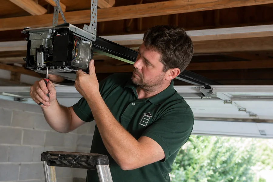 Rescue Garage Doors technician repairing a garage door opener in Corpus Christi, TX